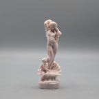 Statute of Aphrodite and cupid a top a claw shell carved from pink opal