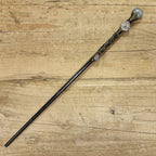 Black wooden magic wand with Aquarius symbol