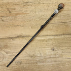 Black wooden magic wand with scorpio symbol