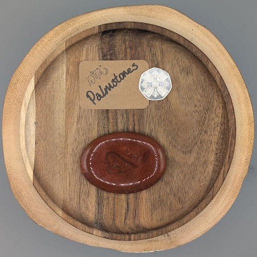 Wooden plate with red jasper stone