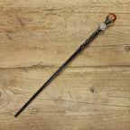 black wooden magic wand with aries symbol