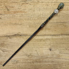black wooden magic wand with cancer symbol