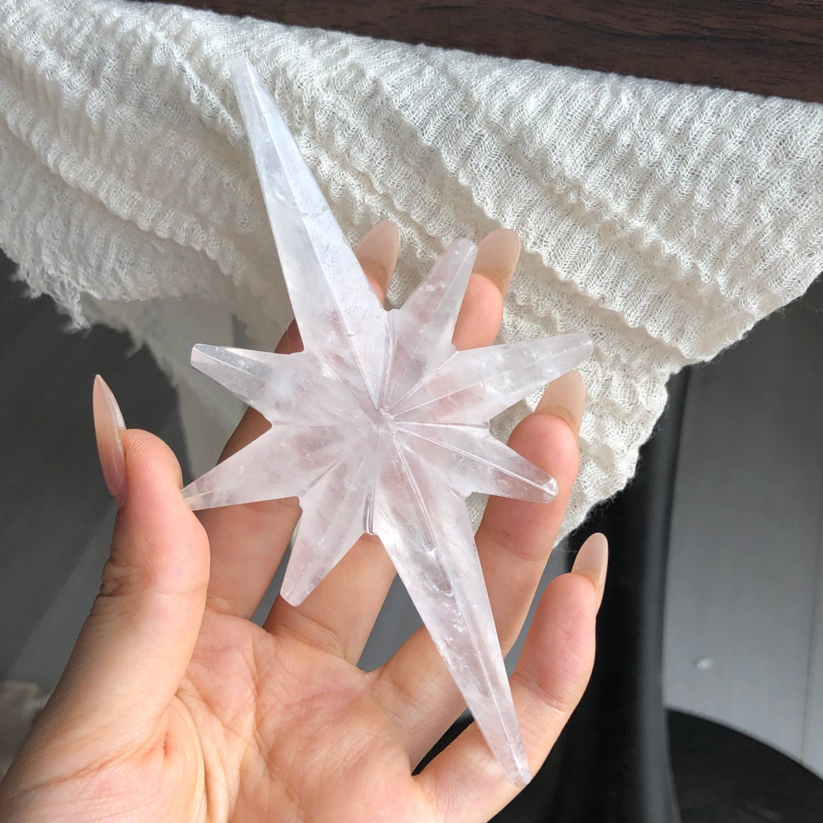 Clear quartz North Star on Metal Stand