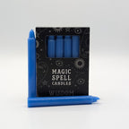 Set of blue spell candles with packaging labeled 'Magic Spell Candles' on a white background