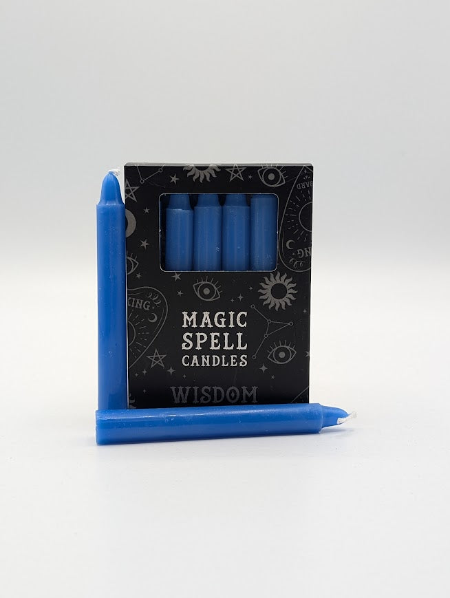 Set of blue spell candles with packaging labeled 'Magic Spell Candles' on a white background