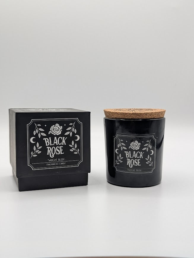 Black candle with cork lid labelled 'Black Rose' twilight blush scented candle with packaging on a white background