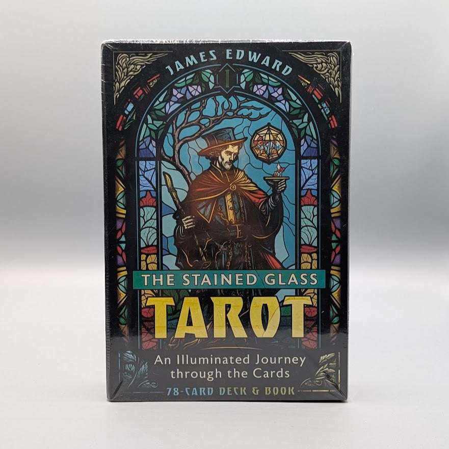 Stained glass tarot card set packaging with a wizard illustration on a gray background